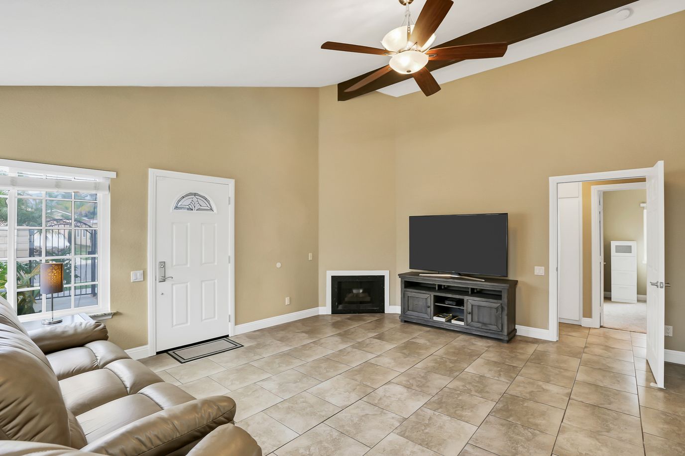 Bright living area with a large window and furniture
