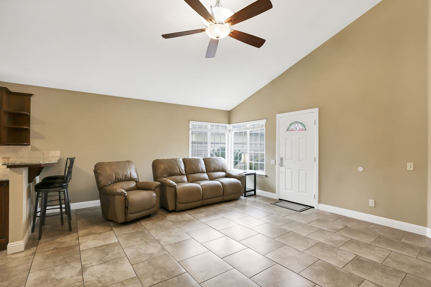Bright common area with comfortable seating and large windows