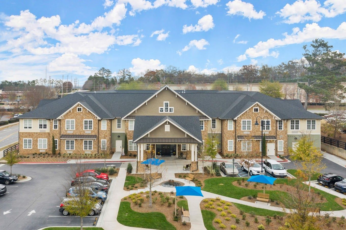 Exterior view of the assisted living facility with gardens