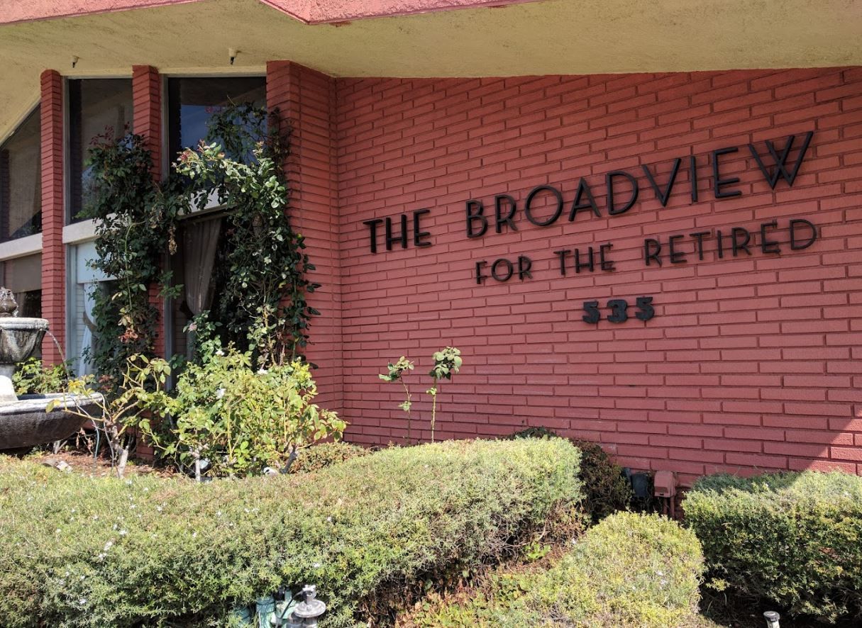 Exterior view of The Broadview facility with landscaping