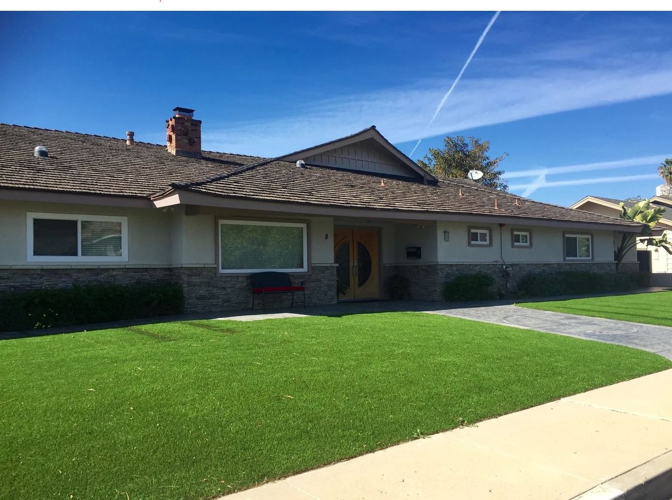 Exterior view of a nursing home building with lawn