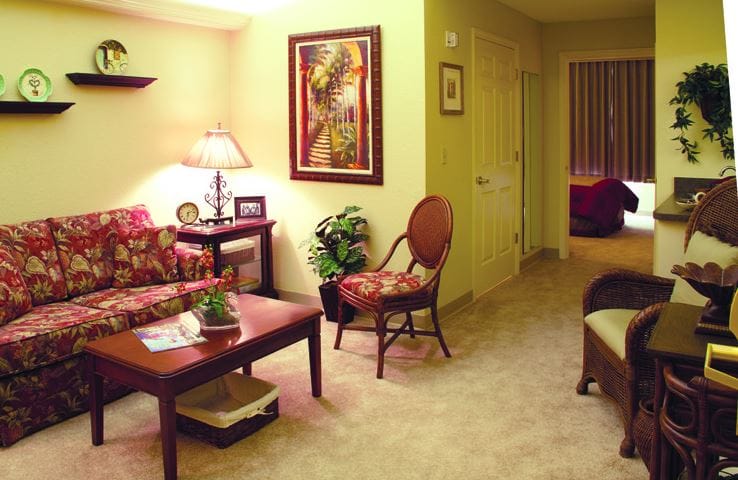 Cozy interior of a resident's room with floral couch