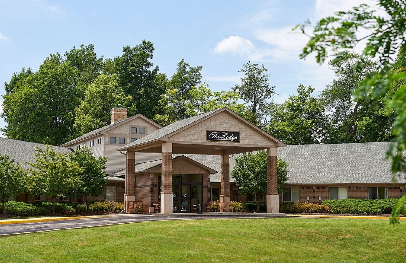 Exterior view of The Lodge with landscaped entrance