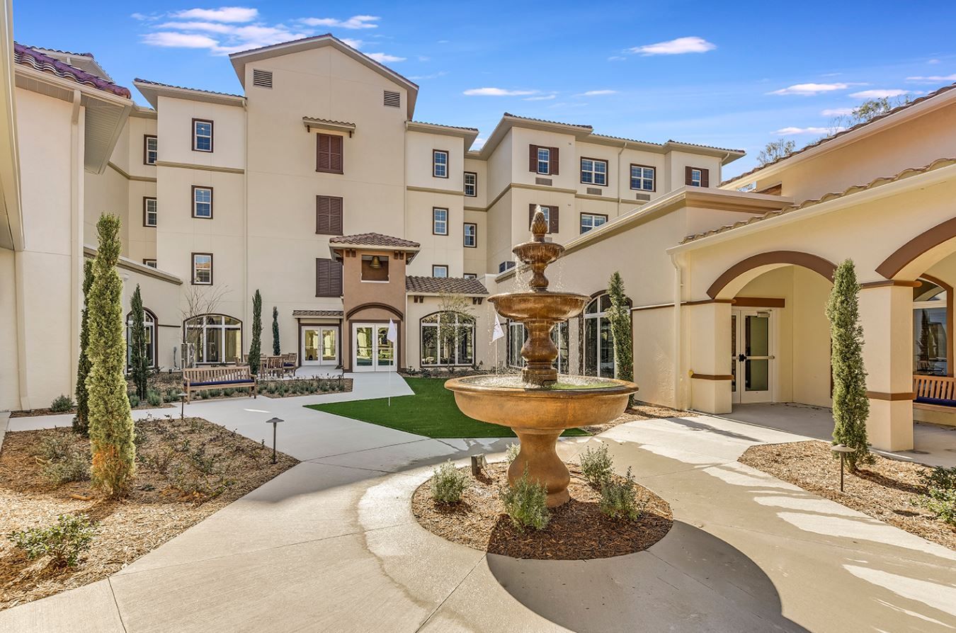 Outdoor view of Tuscan Gardens with a fountain