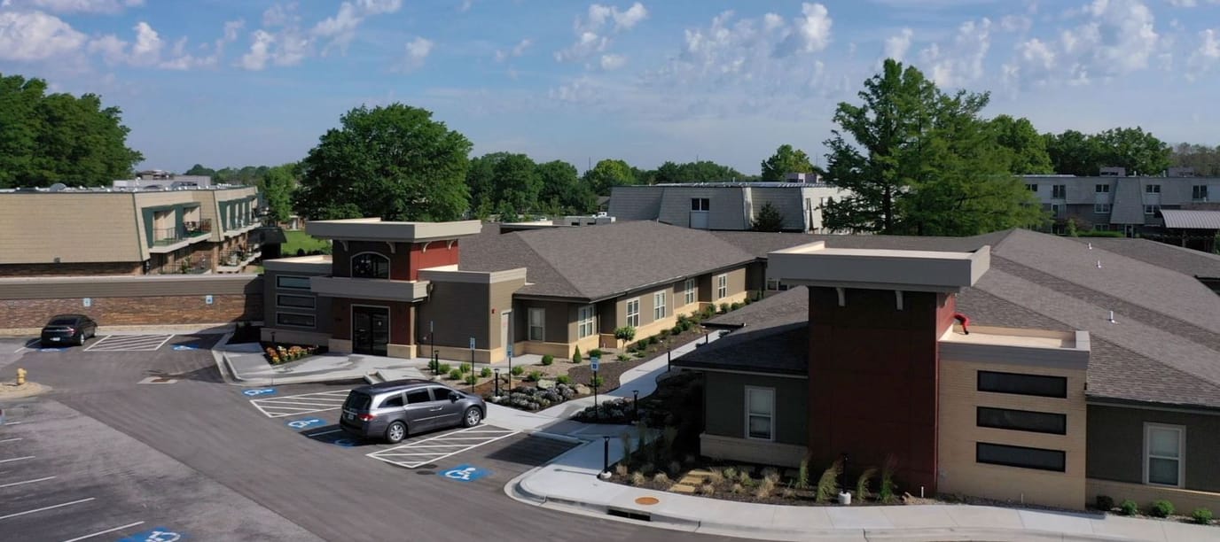 Aerial view of Village Assisted Living buildings and parking