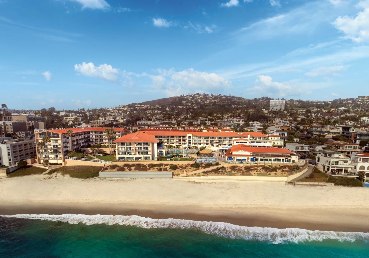 Aerial view of White Sands La Jolla senior living facility by the beach