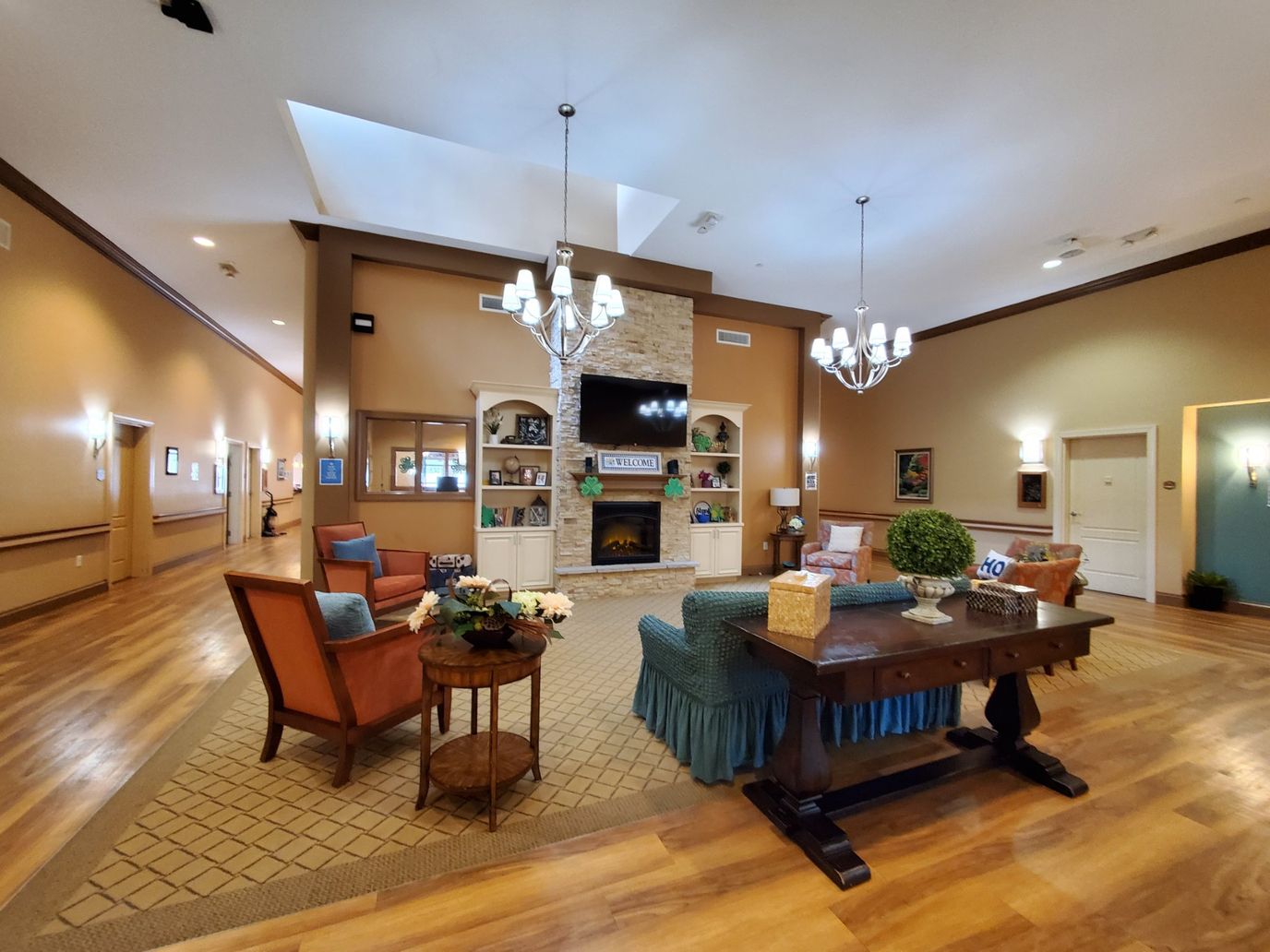 A spacious living room with comfortable seating and a fireplace.