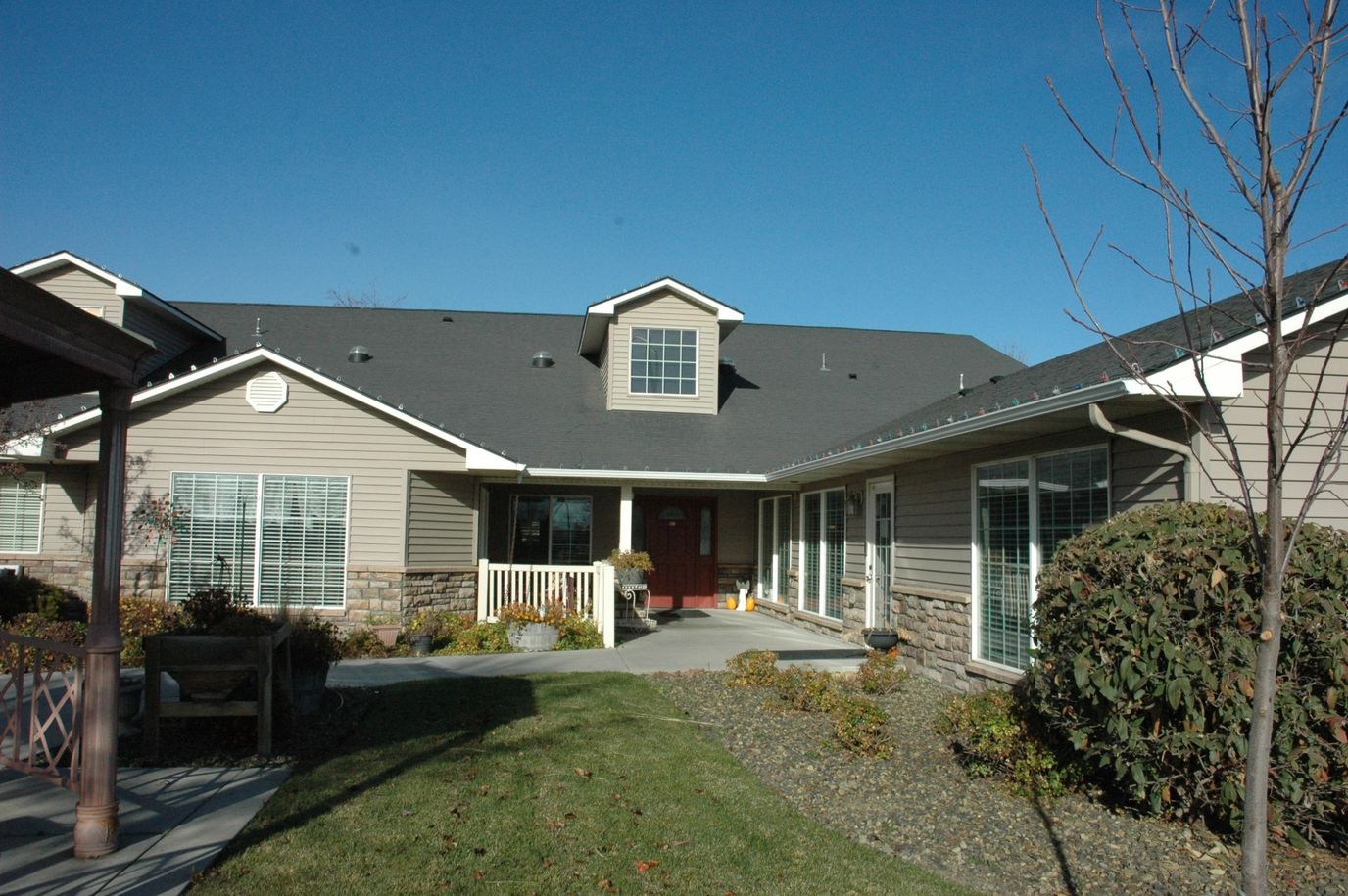 Exterior view of a senior living facility with landscaping