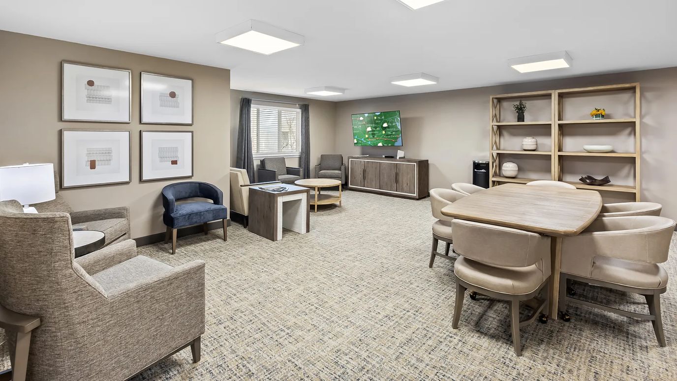Bright common area with seating and tables