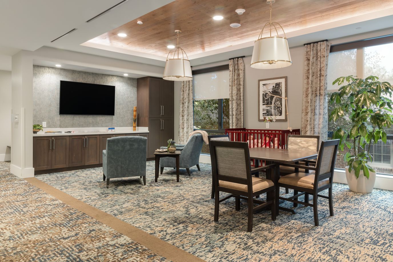 Bright common area with comfortable seating and TV