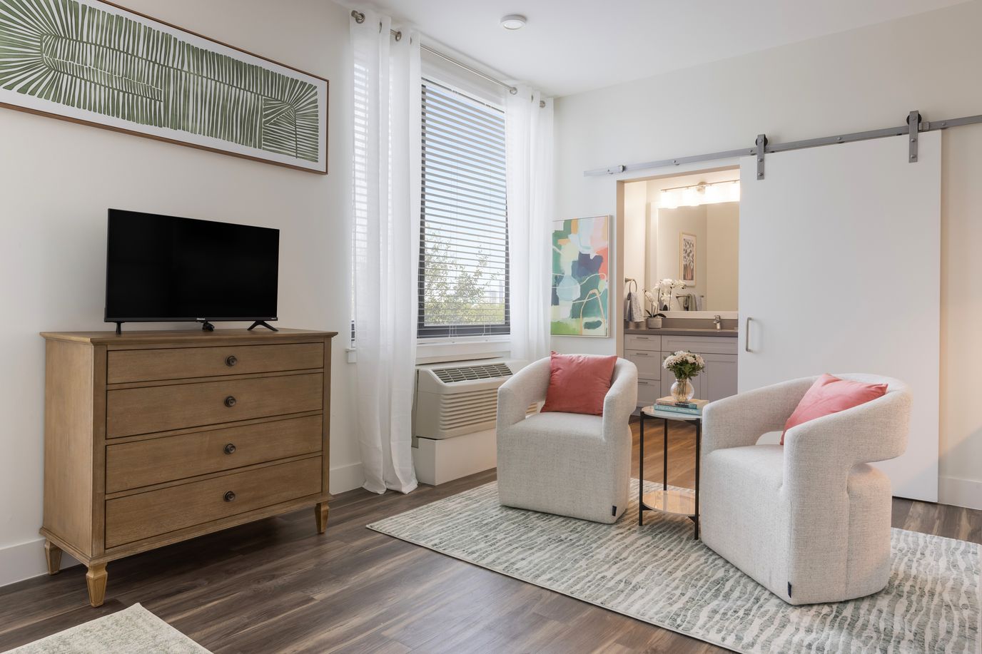 A bright, modern interior of a resident room