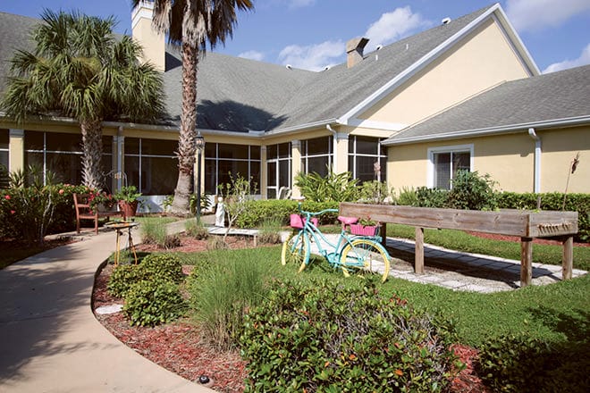 Outdoor garden area with colorful bicycle decor