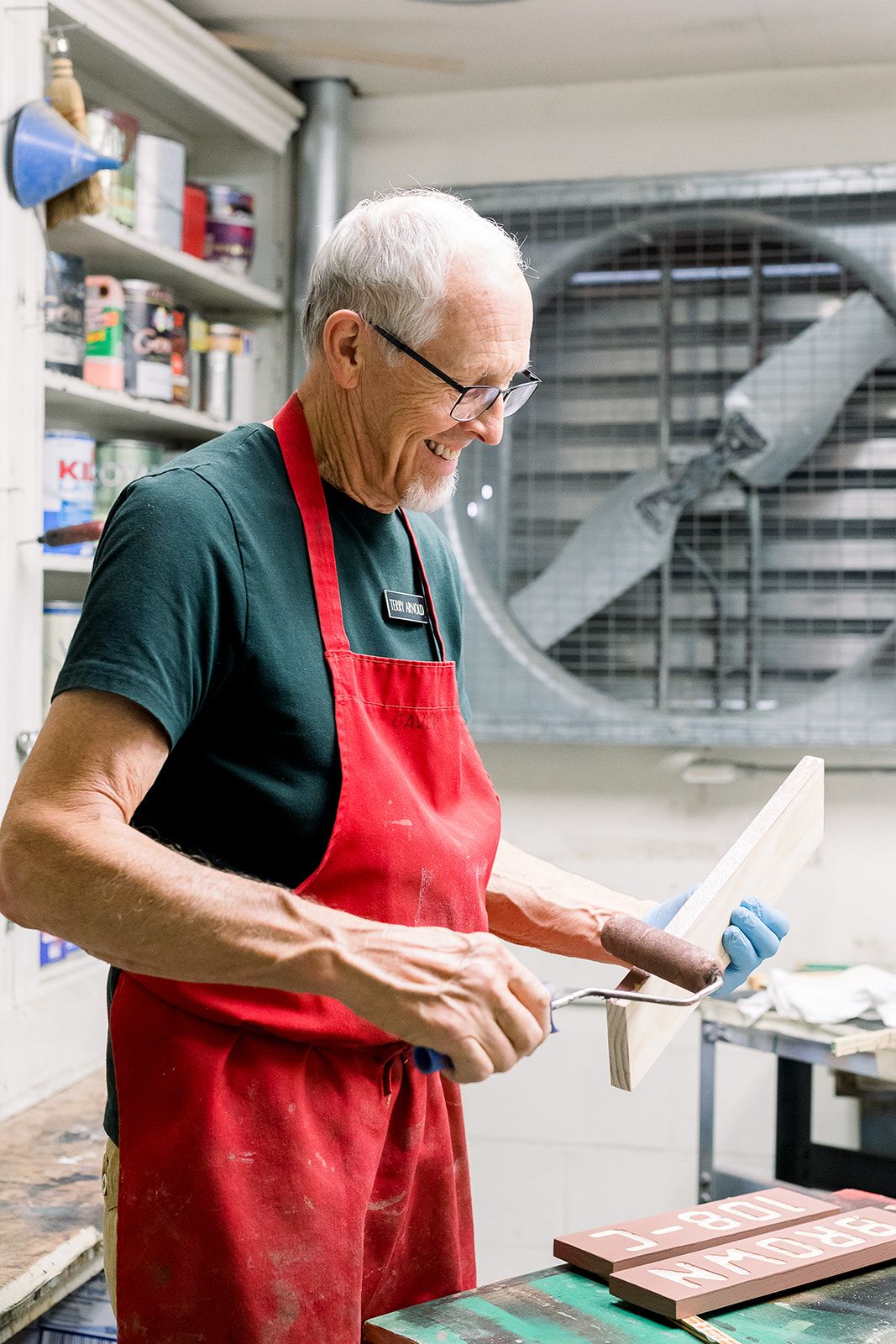 Resident working on a woodworking project in a workshop
