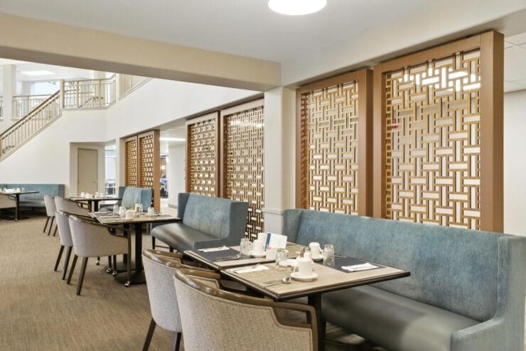 Dining area with tables and decorative partitions