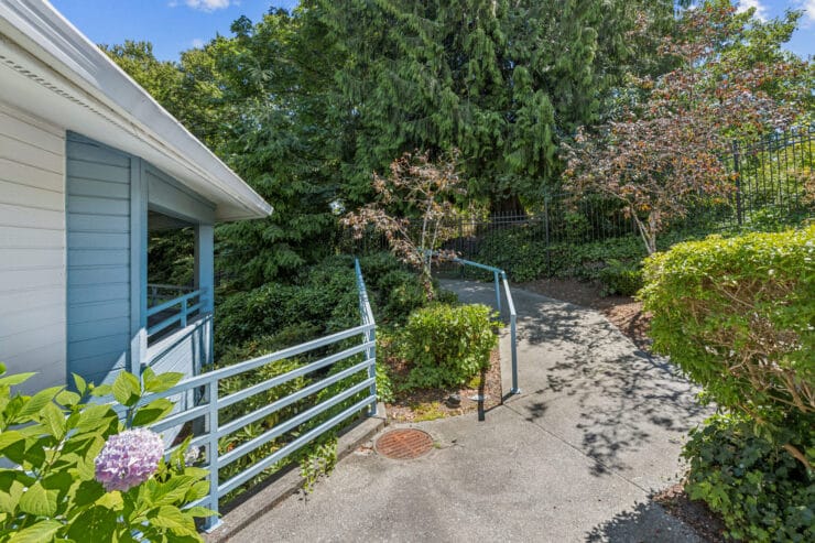 Pathway surrounded by greenery at the facility