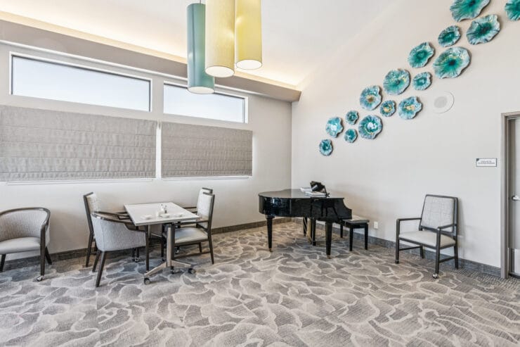 Interior common area with a piano and seating