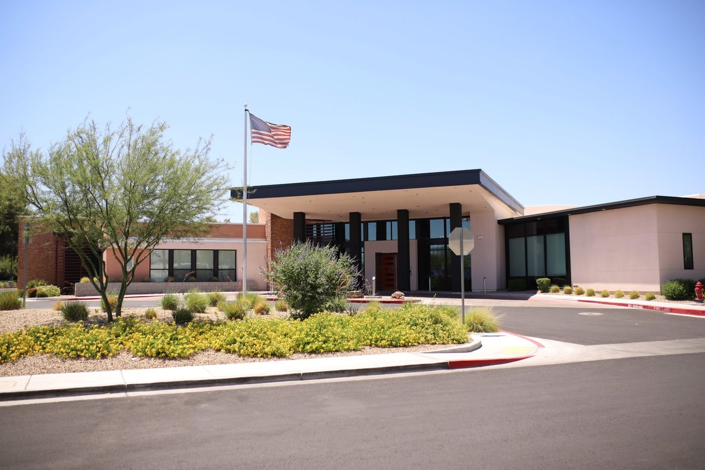 Modern senior living facility exterior with landscaping