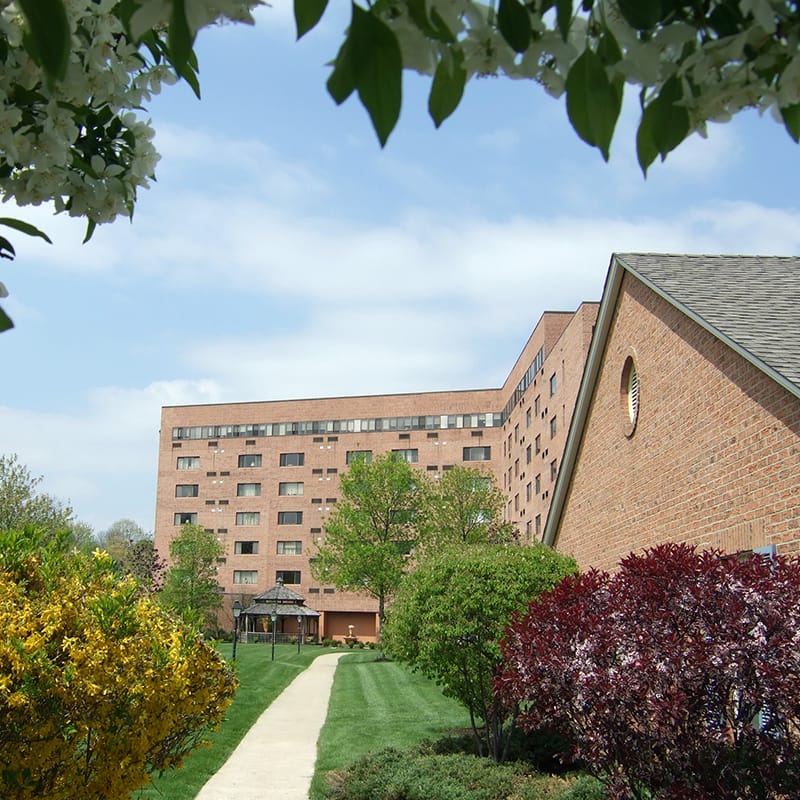 Exterior view of the senior living facility with landscaping