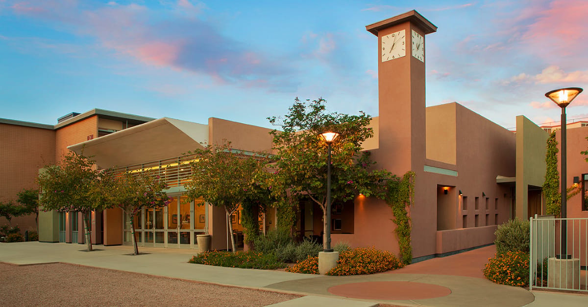 Beatitudes Campus, Nursing Home in Phoenix, AZ — Senior living facility entrance with clock tower and landscaping