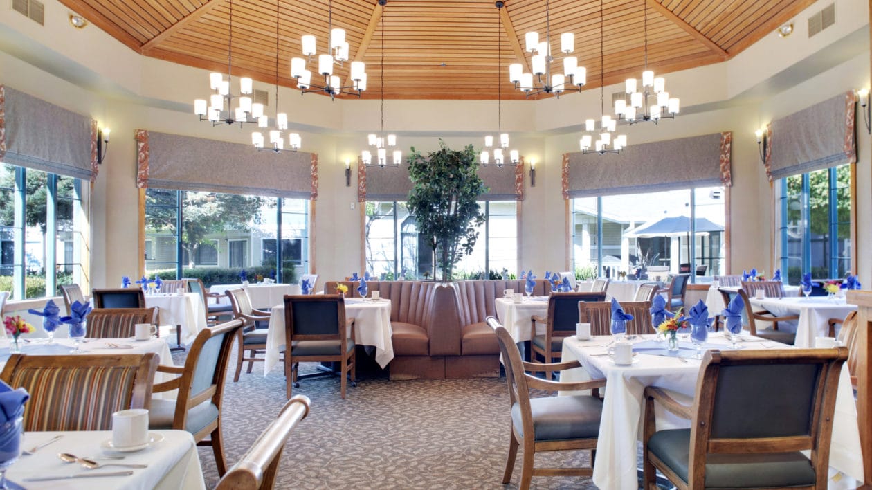 Elegant dining room setup with tables and chairs