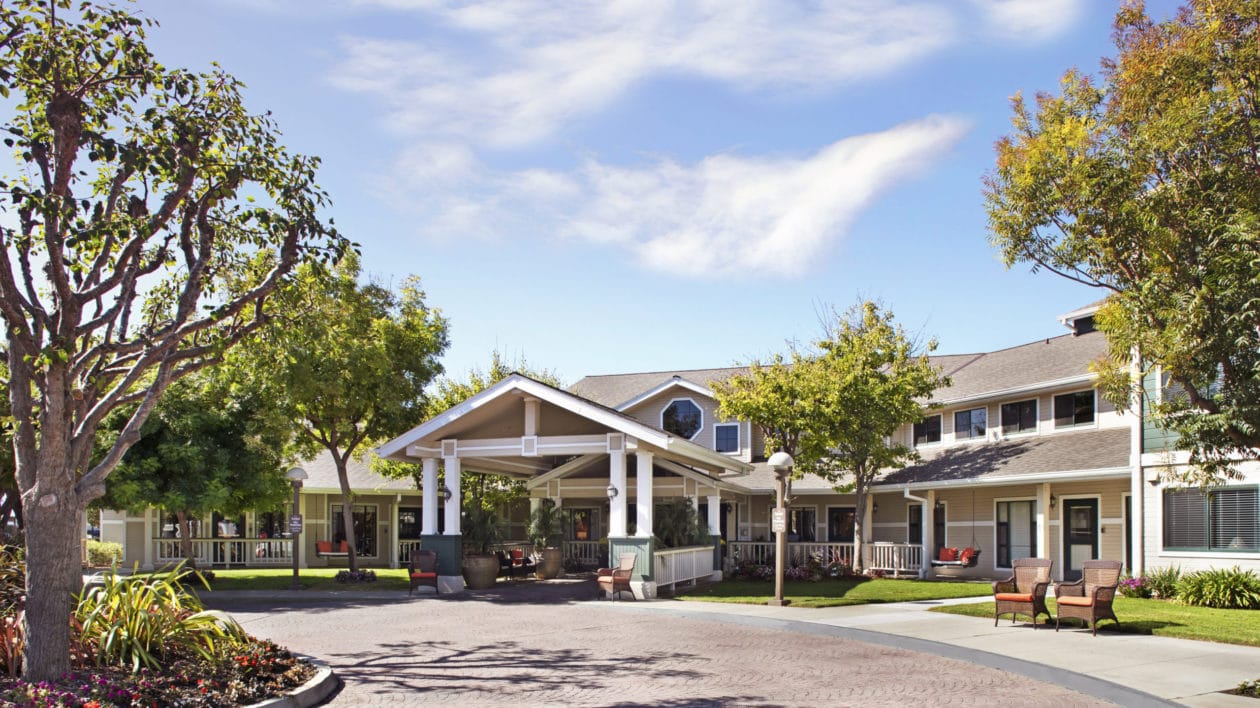Exterior view of Ivy Park at Salinas with gardens and a covered entrance