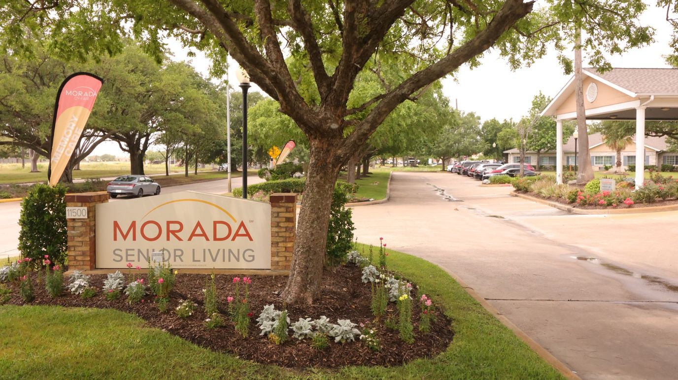 Entrance sign of Morada Senior Living with landscaping