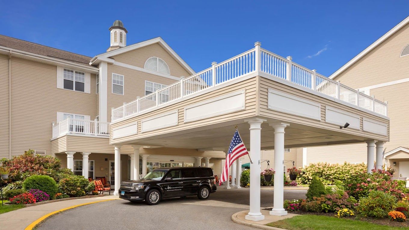 Exterior view of Atria Crossroads Place with an entrance and vehicle