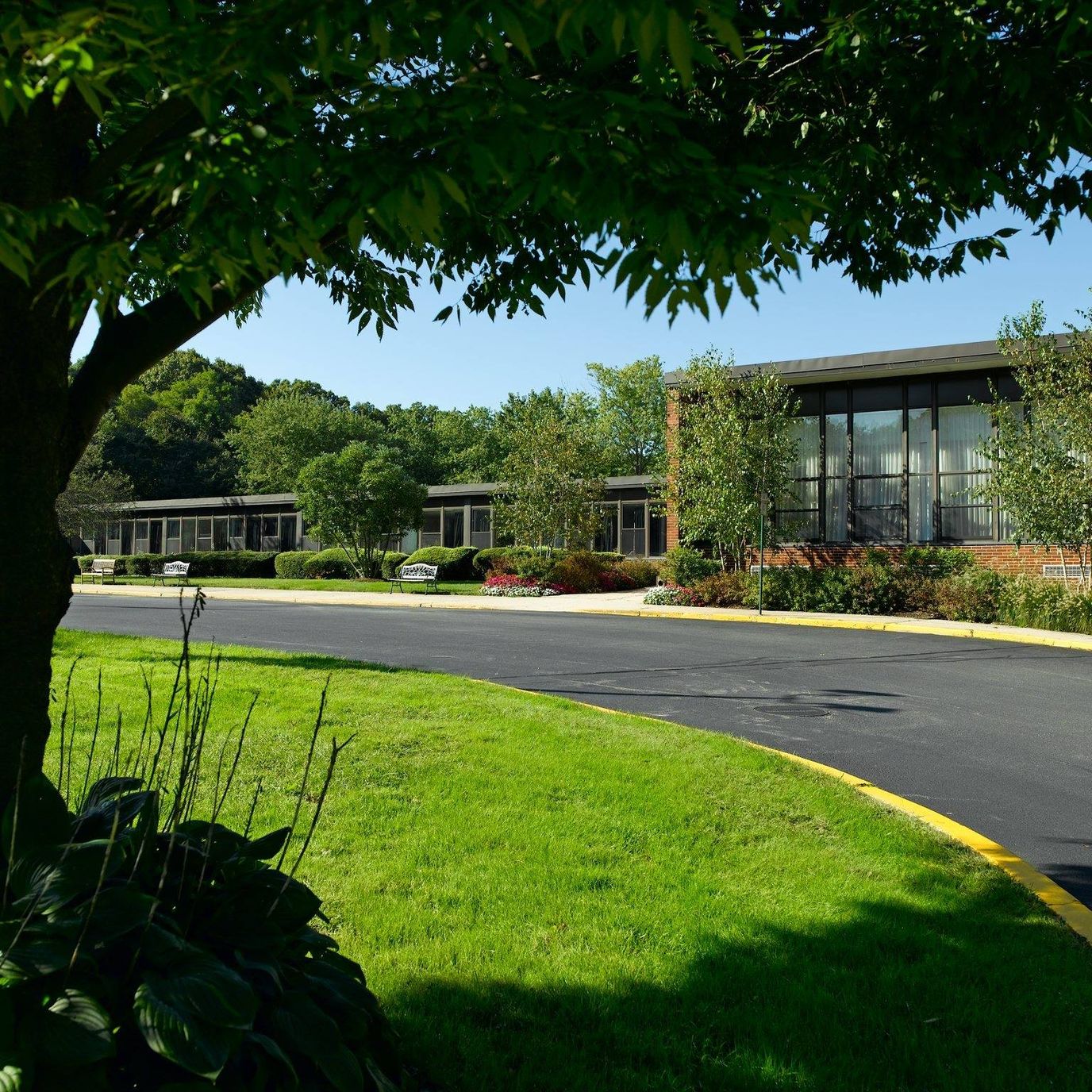 Exterior view of Atria Huntington and landscaped grounds