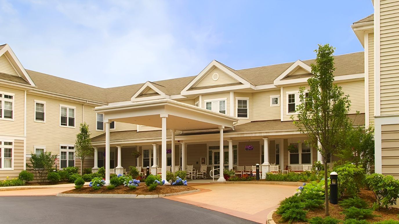 Entrance of Atria Longmeadow Place with landscaped surroundings