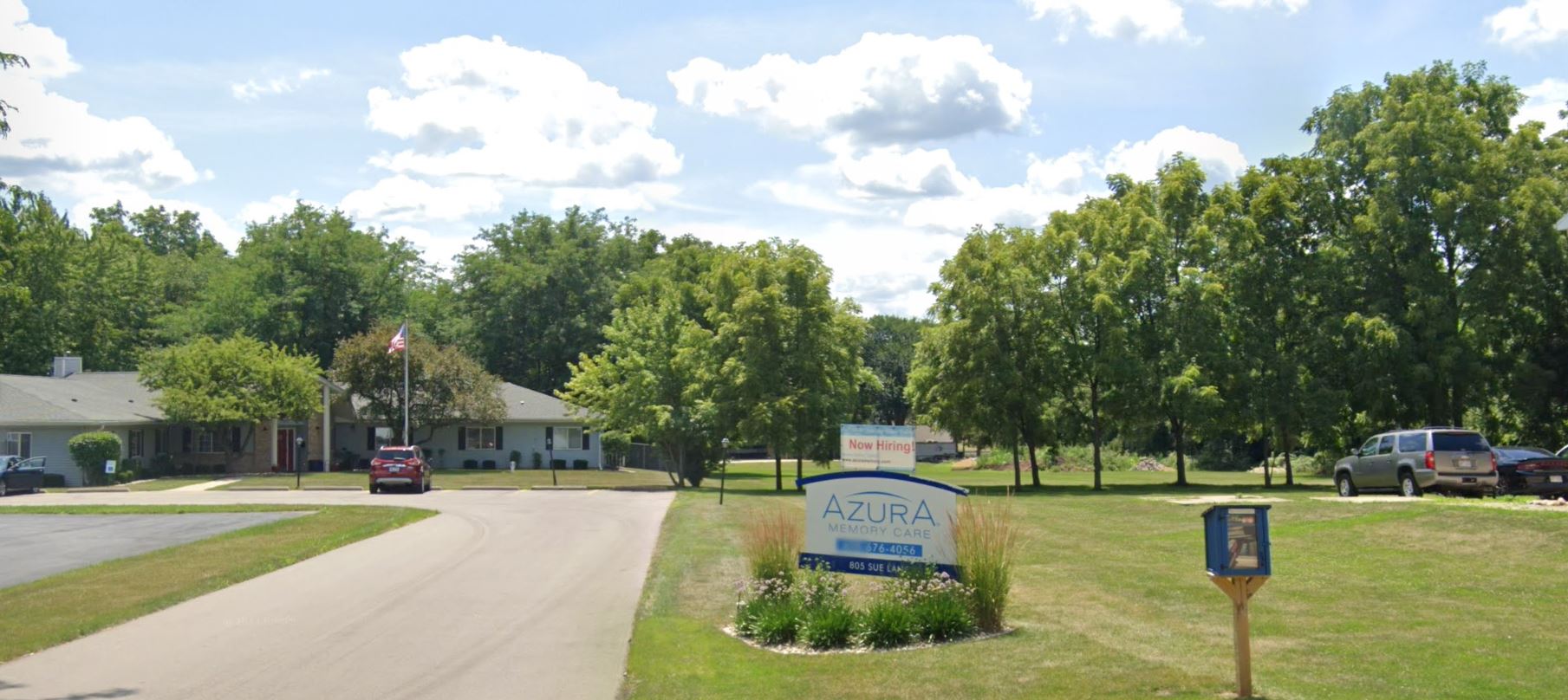 Exterior view of Azura Memory Care facility with signage