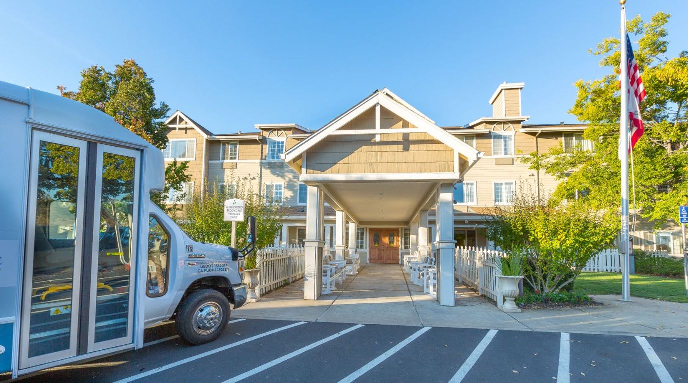 Front entrance of Brookdale Auburn with shuttle bus