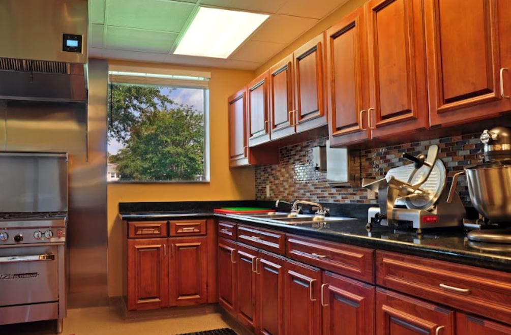 Modern kitchen with wooden cabinets and stainless steel appliances