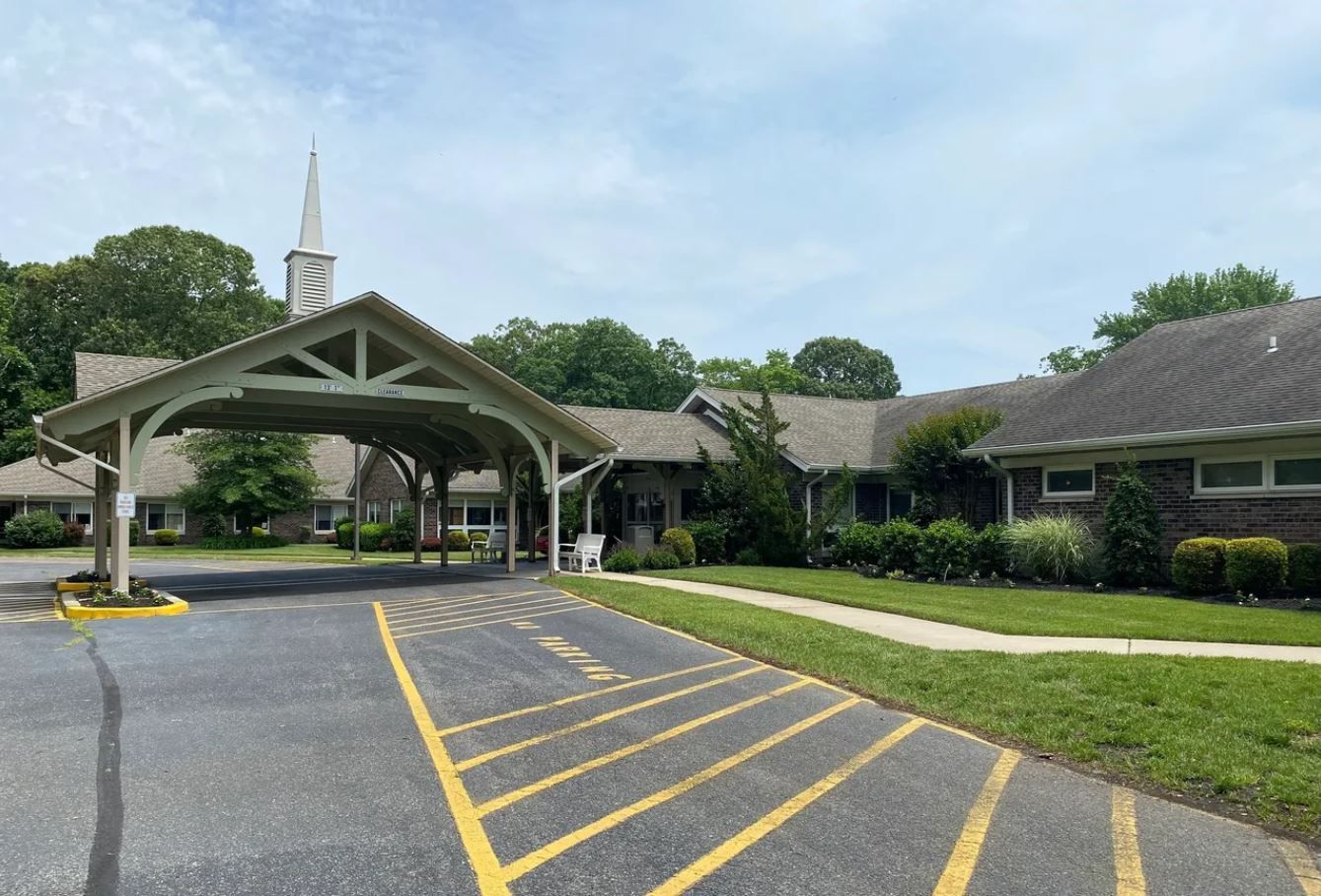 Exterior view of the facility entrance with landscaping