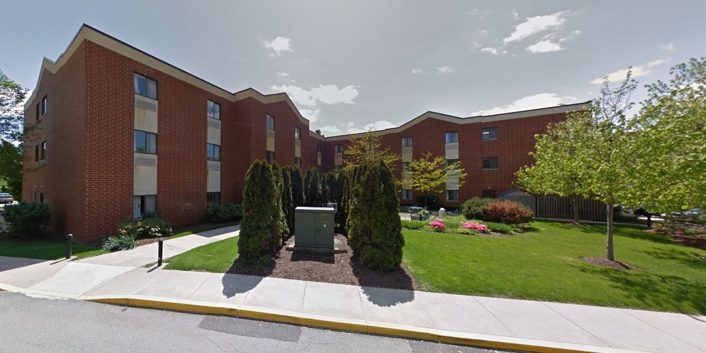 Exterior view of Seneca Place Village with landscaped grounds