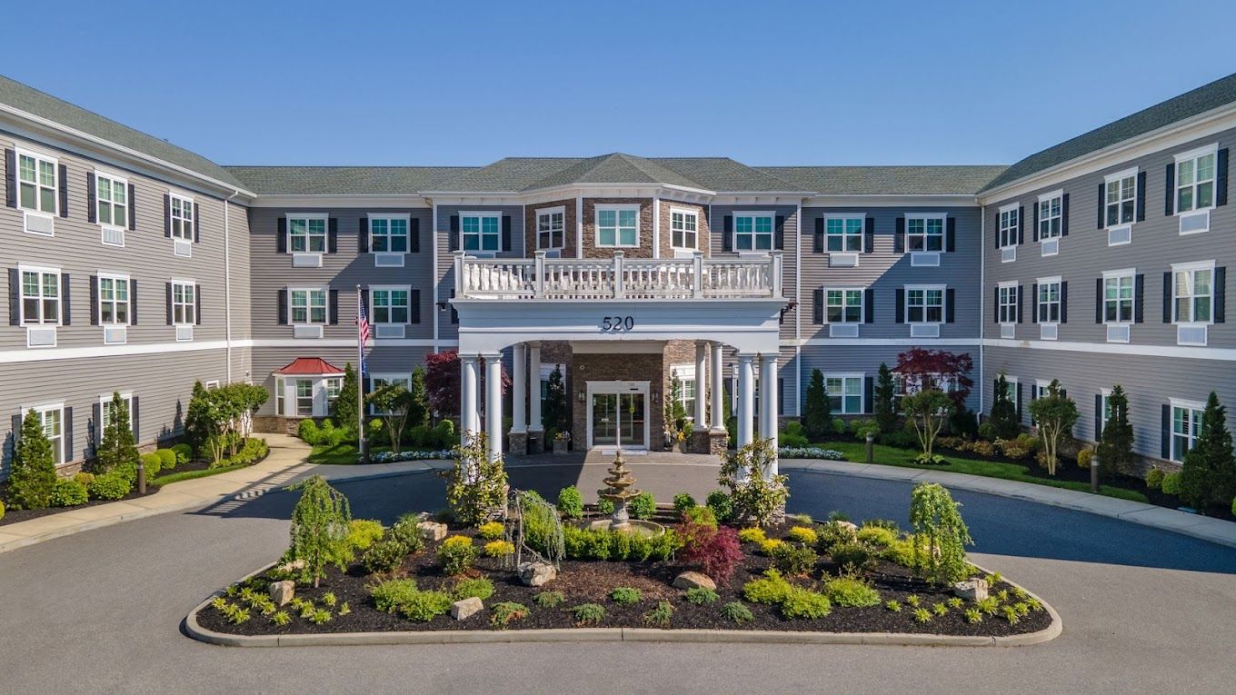 Exterior view of The Bristal at West Babylon with landscaped entrance