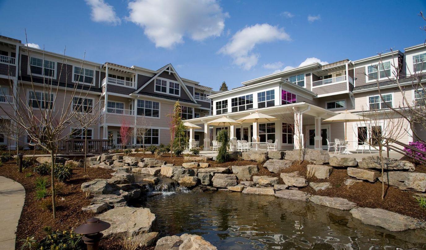 Outdoor view of the facility with a water feature and seating area