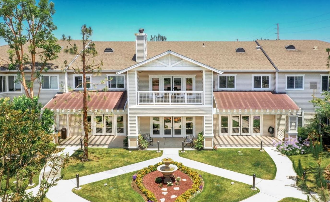 Exterior view of Whittier Place with courtyard and fountain