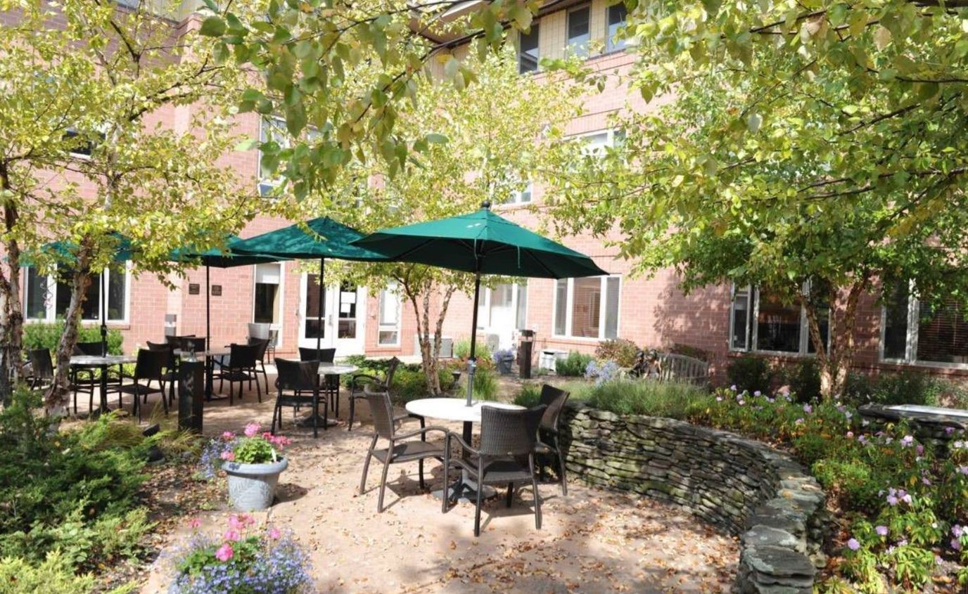 Outdoor patio area with tables and umbrellas