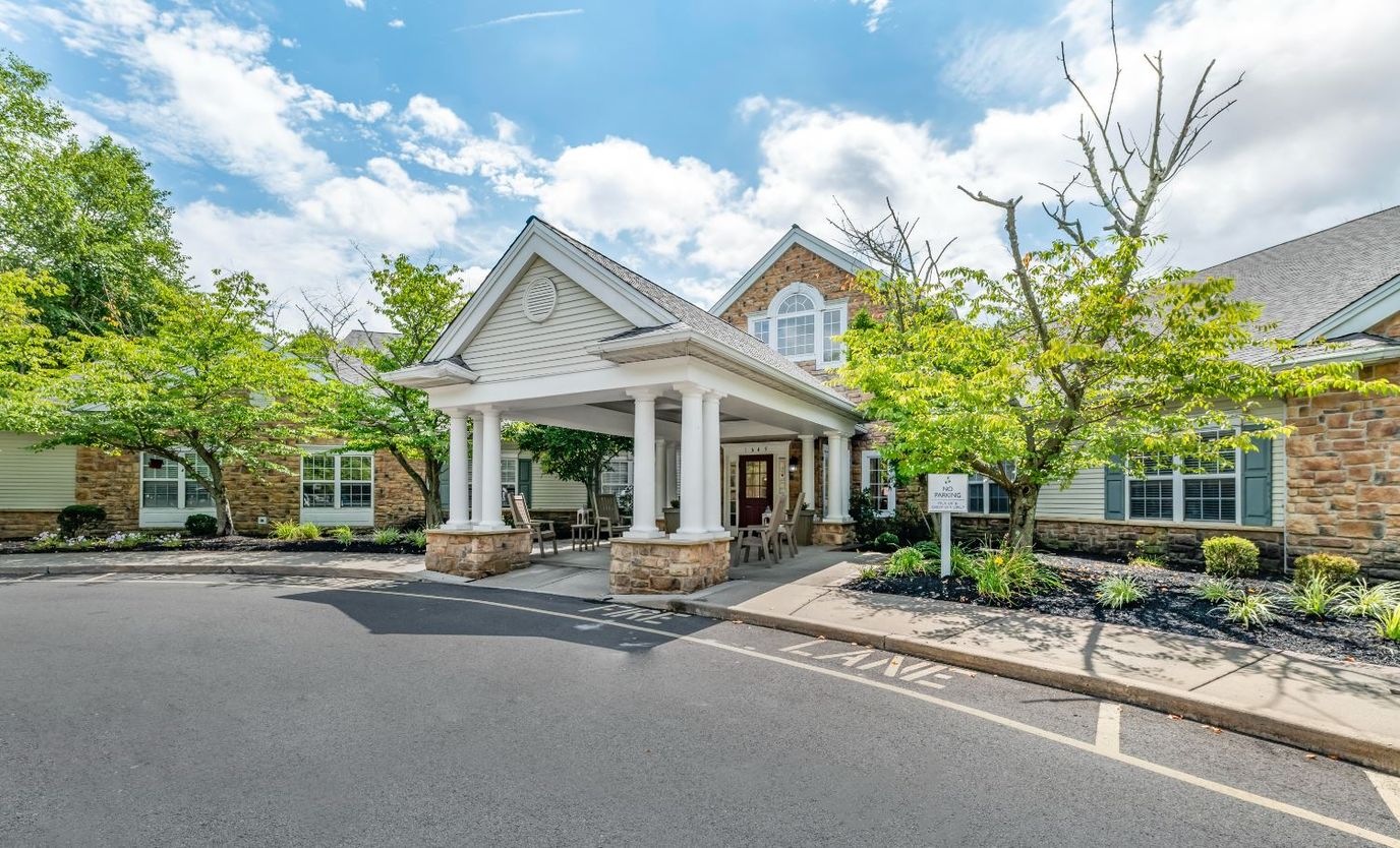Exterior view of Brookdale Hamilton entrance with landscaping