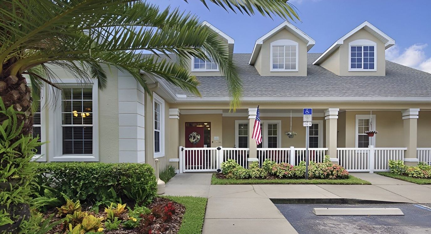 Front entrance of a senior living facility with landscaping