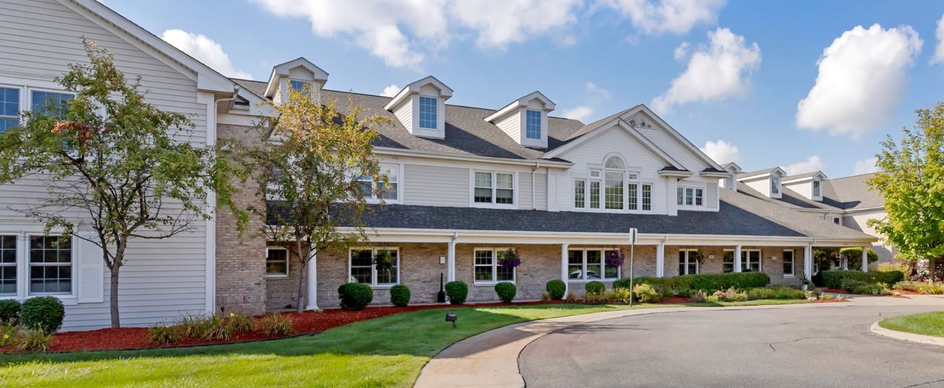 Exterior view of Brookdale Northville with landscaped entrance