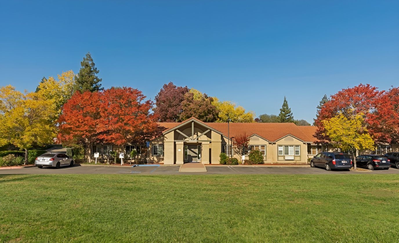 Exterior view of Brookdale Roseville surrounded by autumn trees