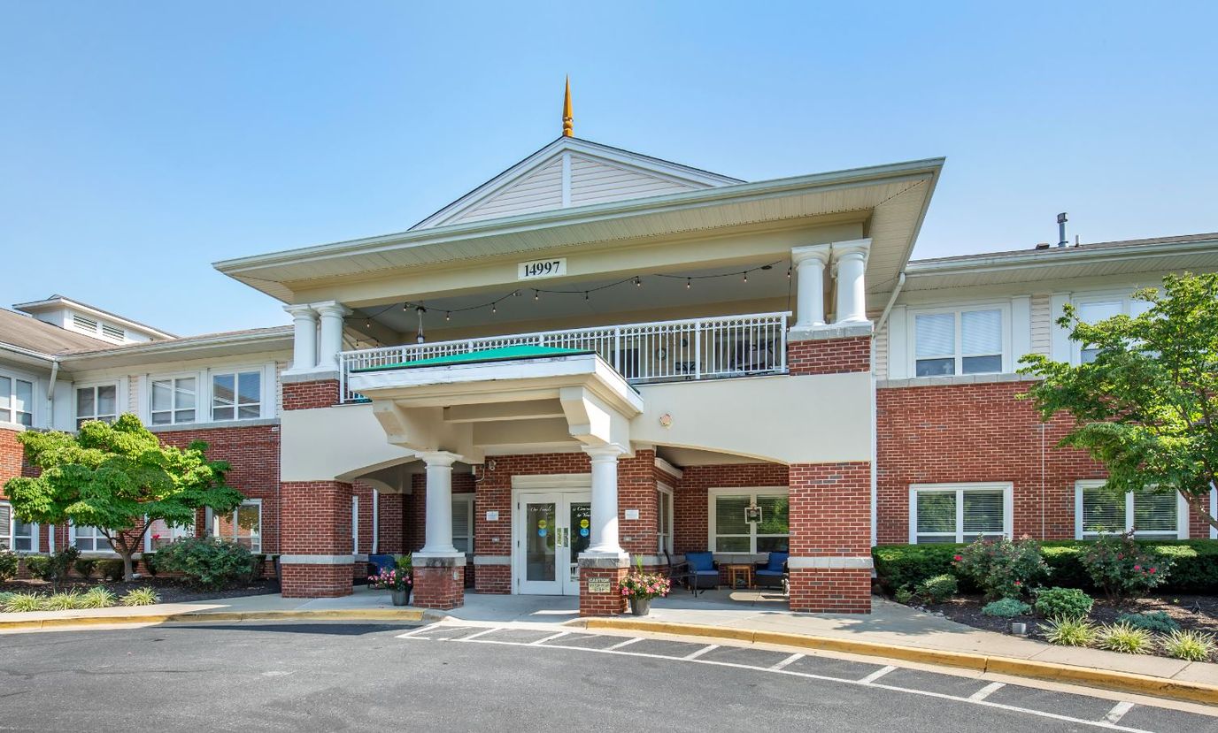 Front entrance of a senior living facility with landscaping