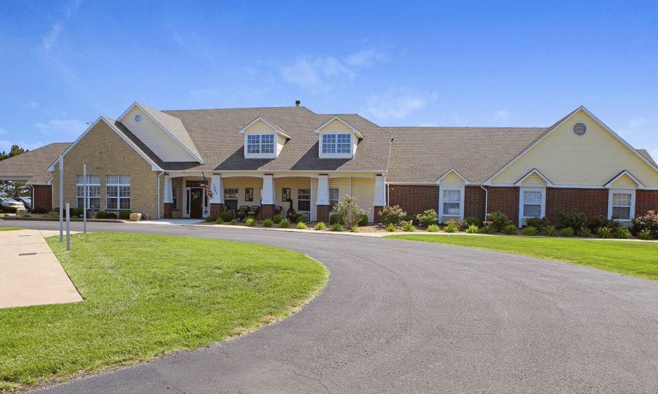 Exterior view of Brookdale Derby facility surrounded by greenery.