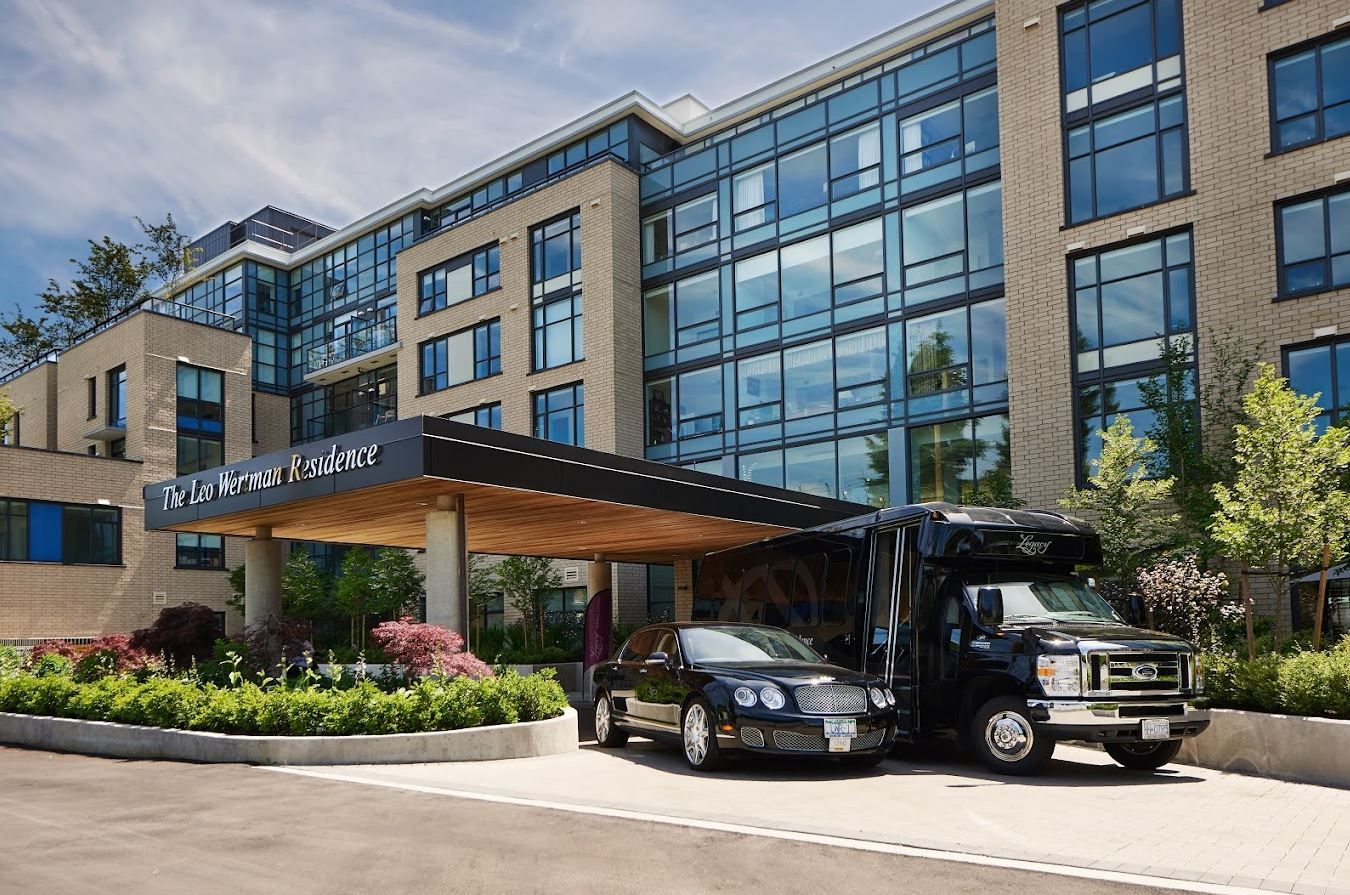 Exterior view of the facility with shuttle and entrance