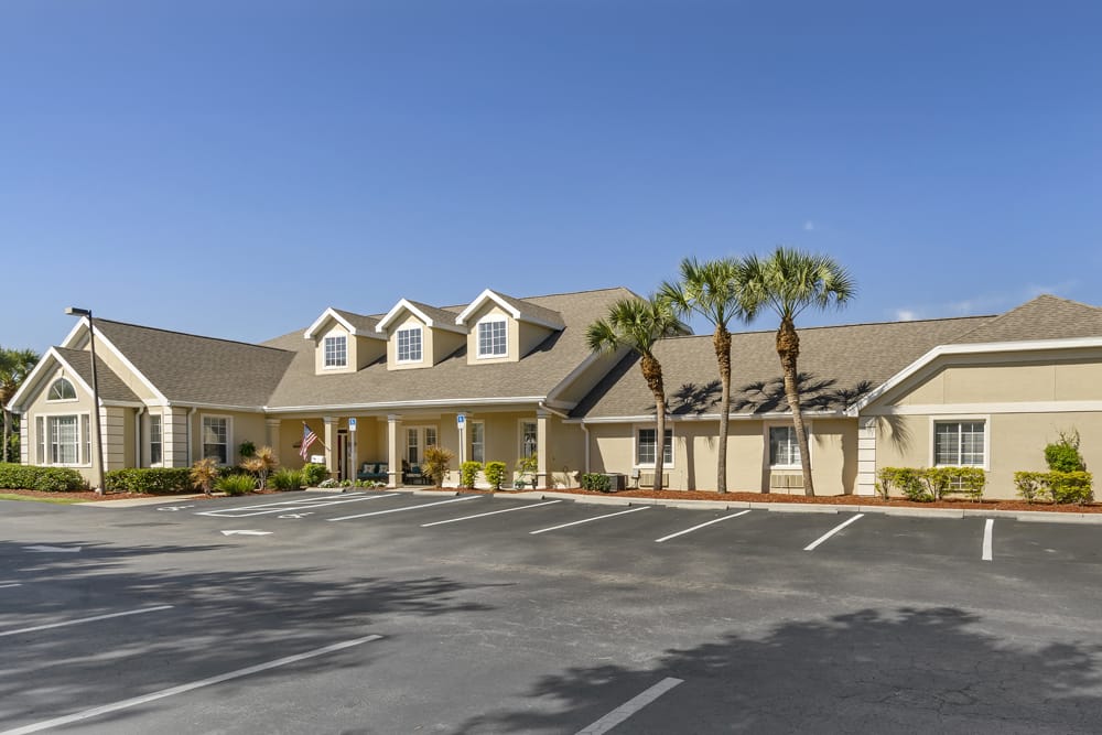 Exterior view of Brookdale Rotonda with palm trees