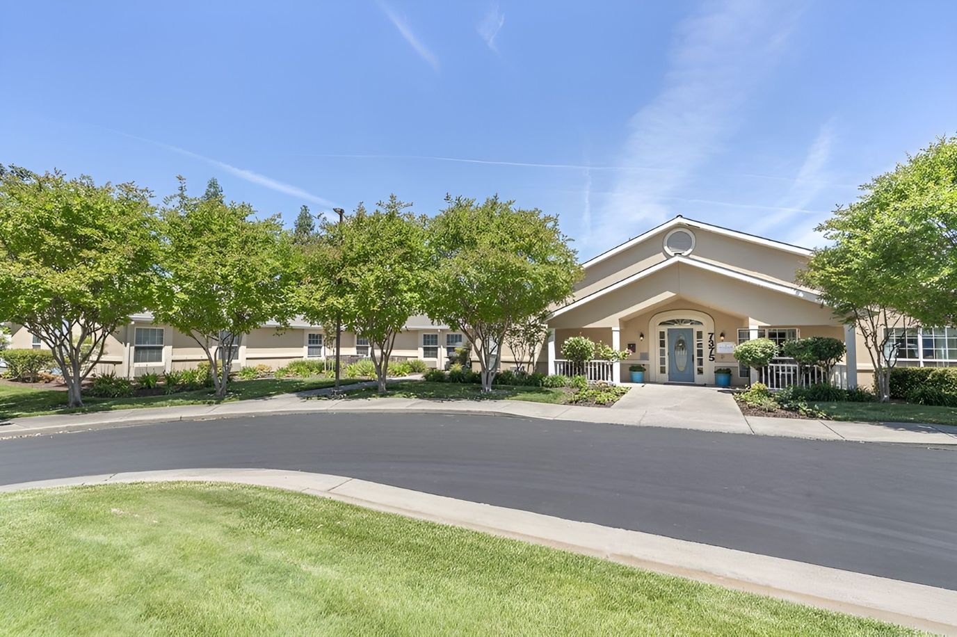 Exterior view of Brookdale Sylvan Ranch facility with landscaped entrance