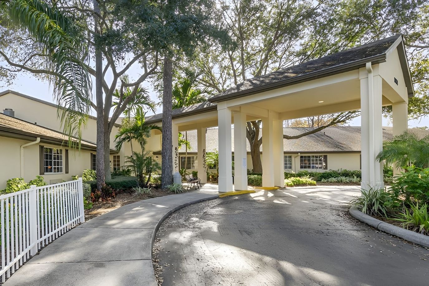Front entrance of Brookdale Tarpon Springs with trees
