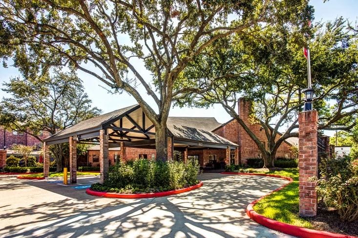 Exterior view of Tarrytowne Estates under a shaded area