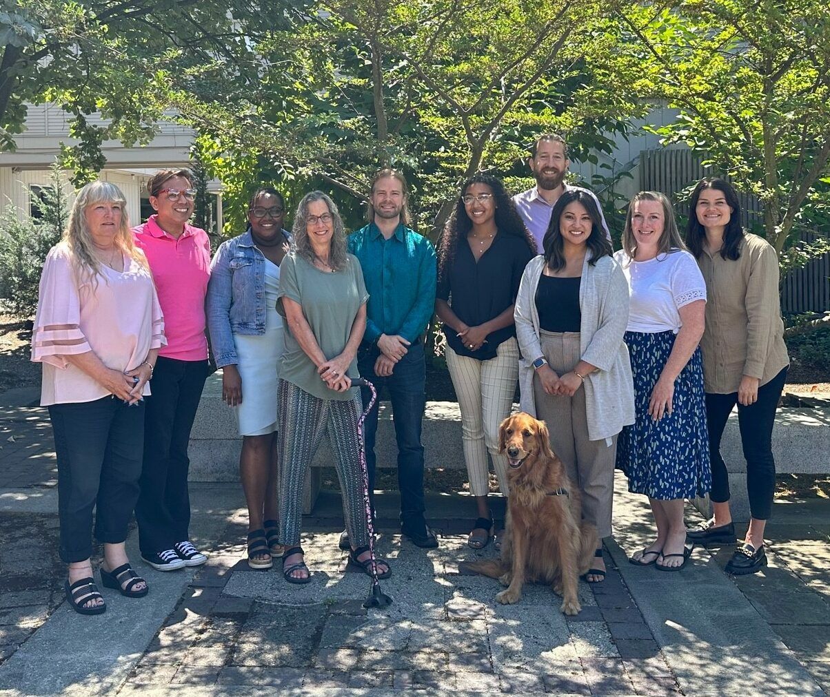 A group photo of staff members at With a Little Help senior living facility.